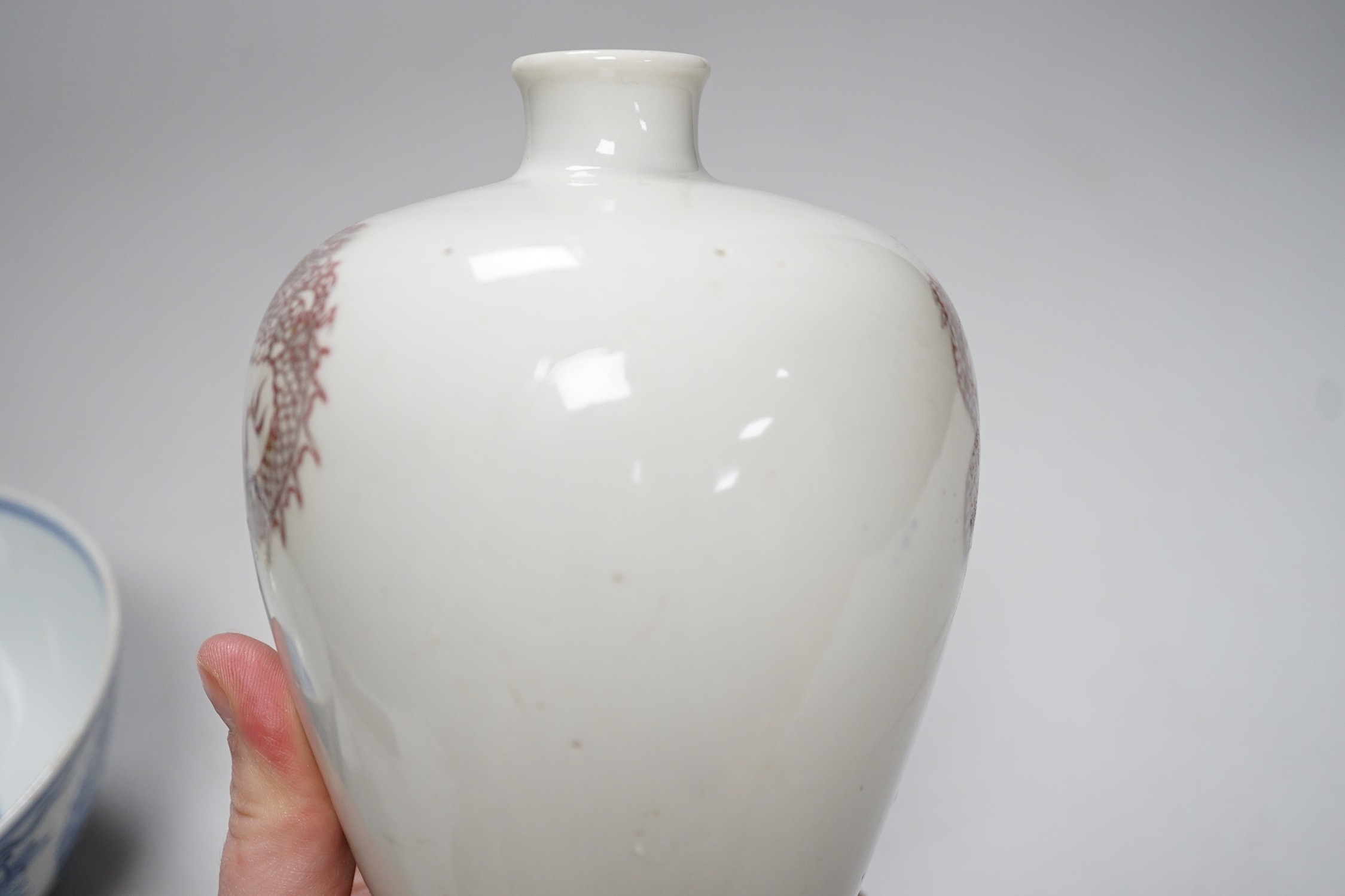A Chinese underglaze copper red meiping a.f. and a Chinese blue and white bowl. Tallest 15cm